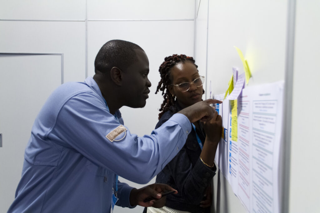 Two participants discussing material in a workshop.