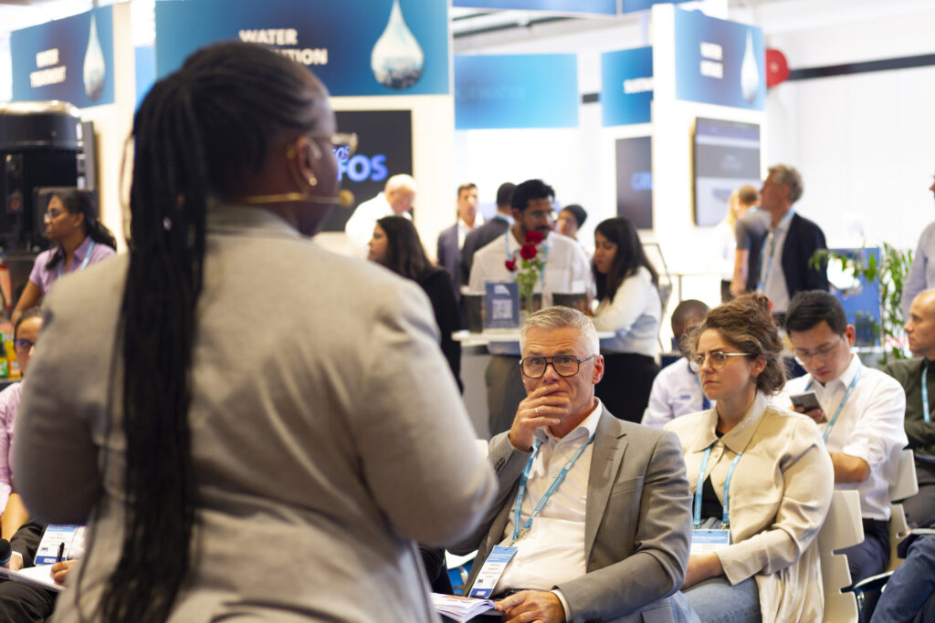 A female participant pitching her startup at the Harbourbasin stage at the IWA World Congress 2022.