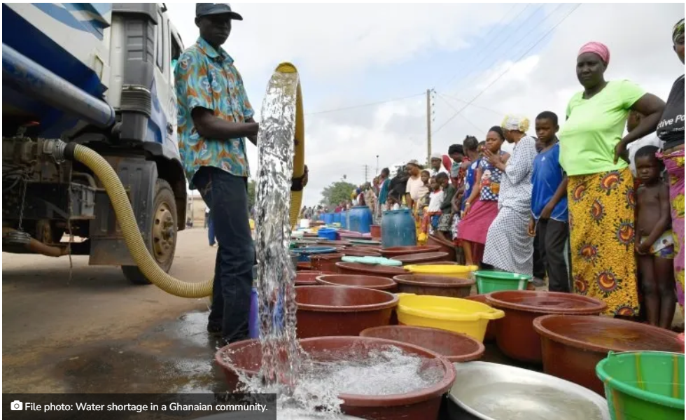 People with buckets queuing for the water truck.